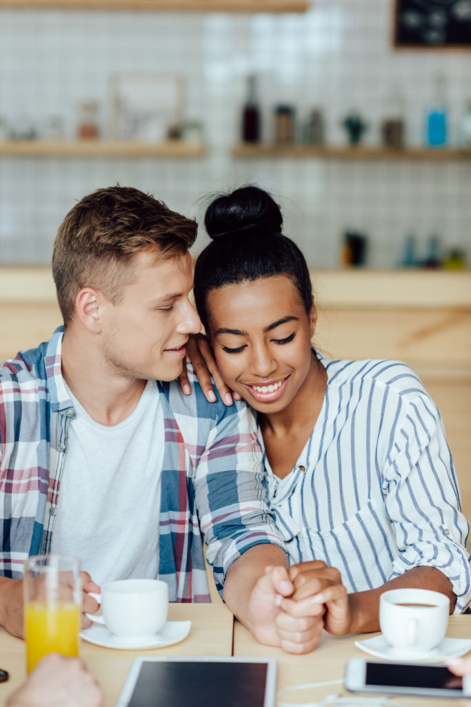 woman smiling with her husband after getting her teeth whitened in Poway, CA